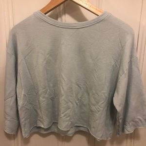 Blue 3/4 length sweatshirt with flared sleeves